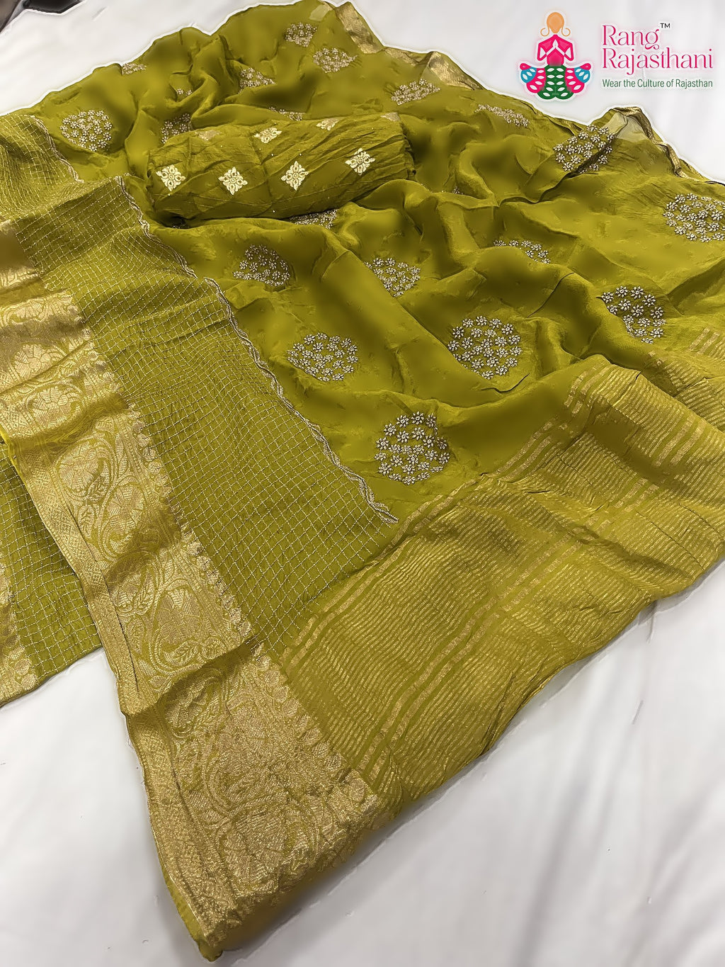 close up detailing of green pure silk zari embroidery saree 