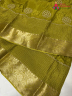 close up view of green pure silk zari embroidery saree