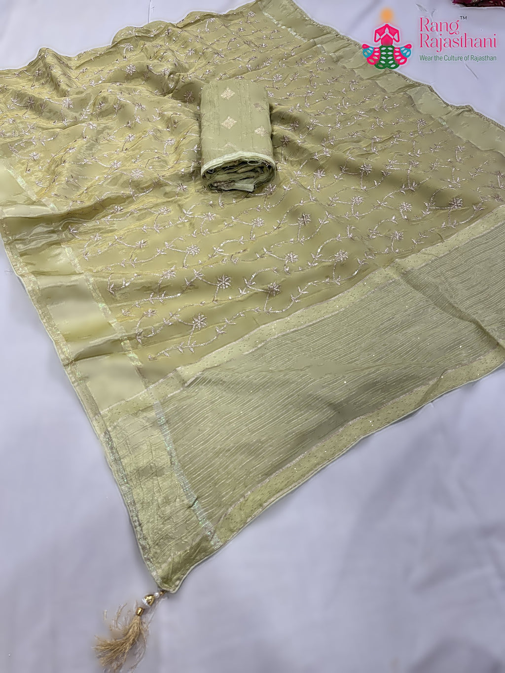pallu detailing of green pure tissue silk zari embroidery saree 