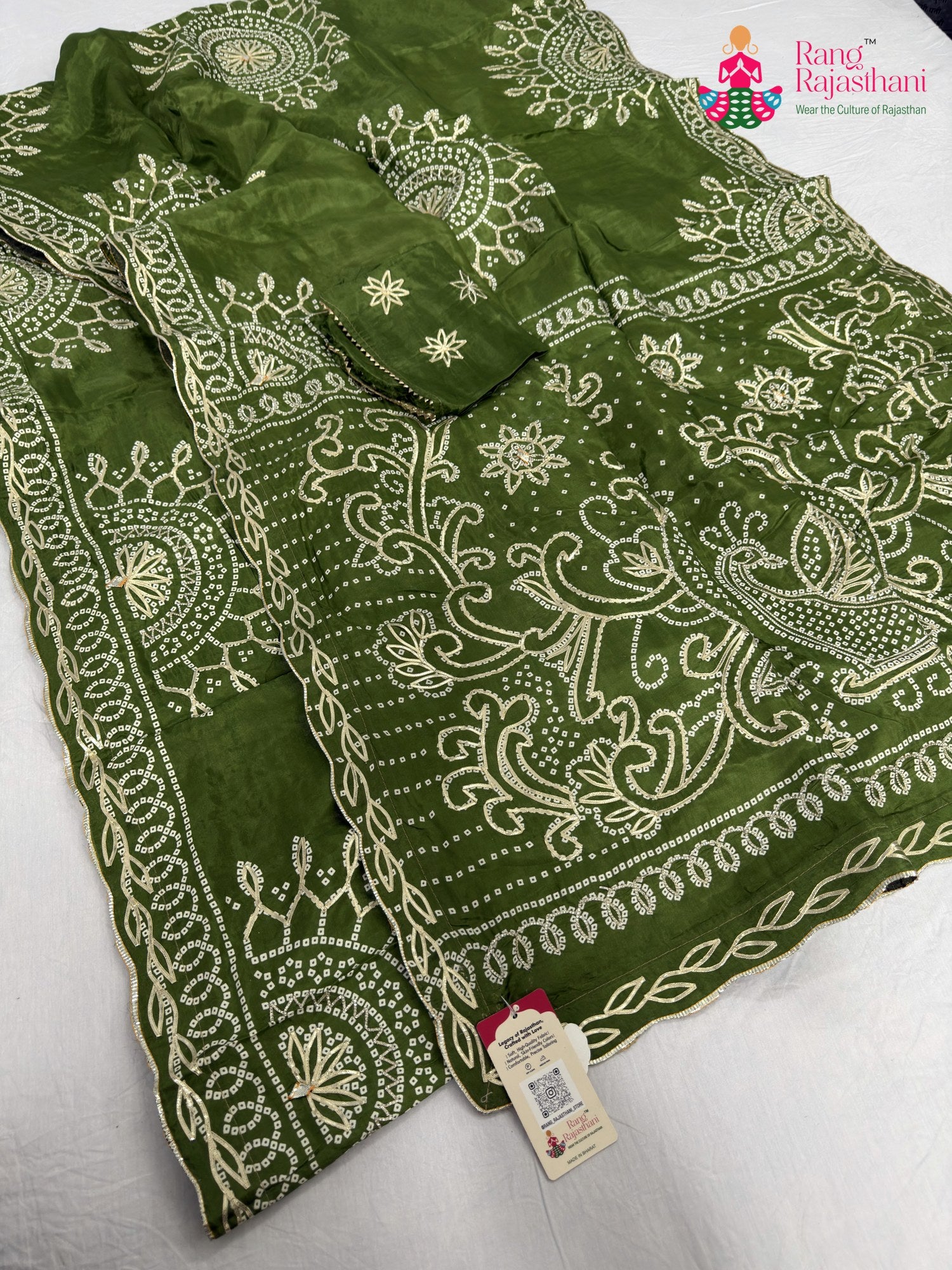 close up detailing of green pure upada silk bandhani saree