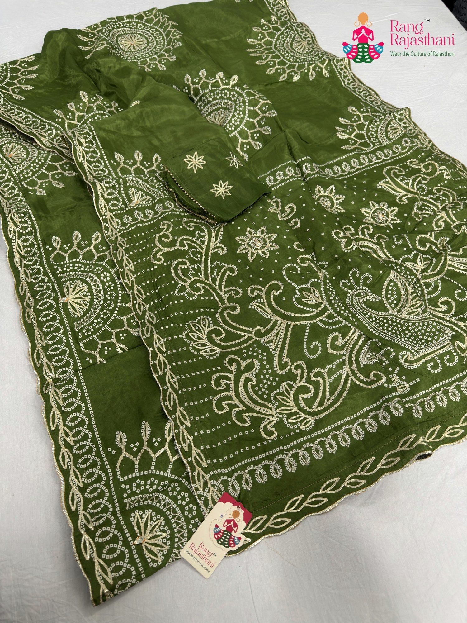 border detailing of green pure upada silk bandhani saree