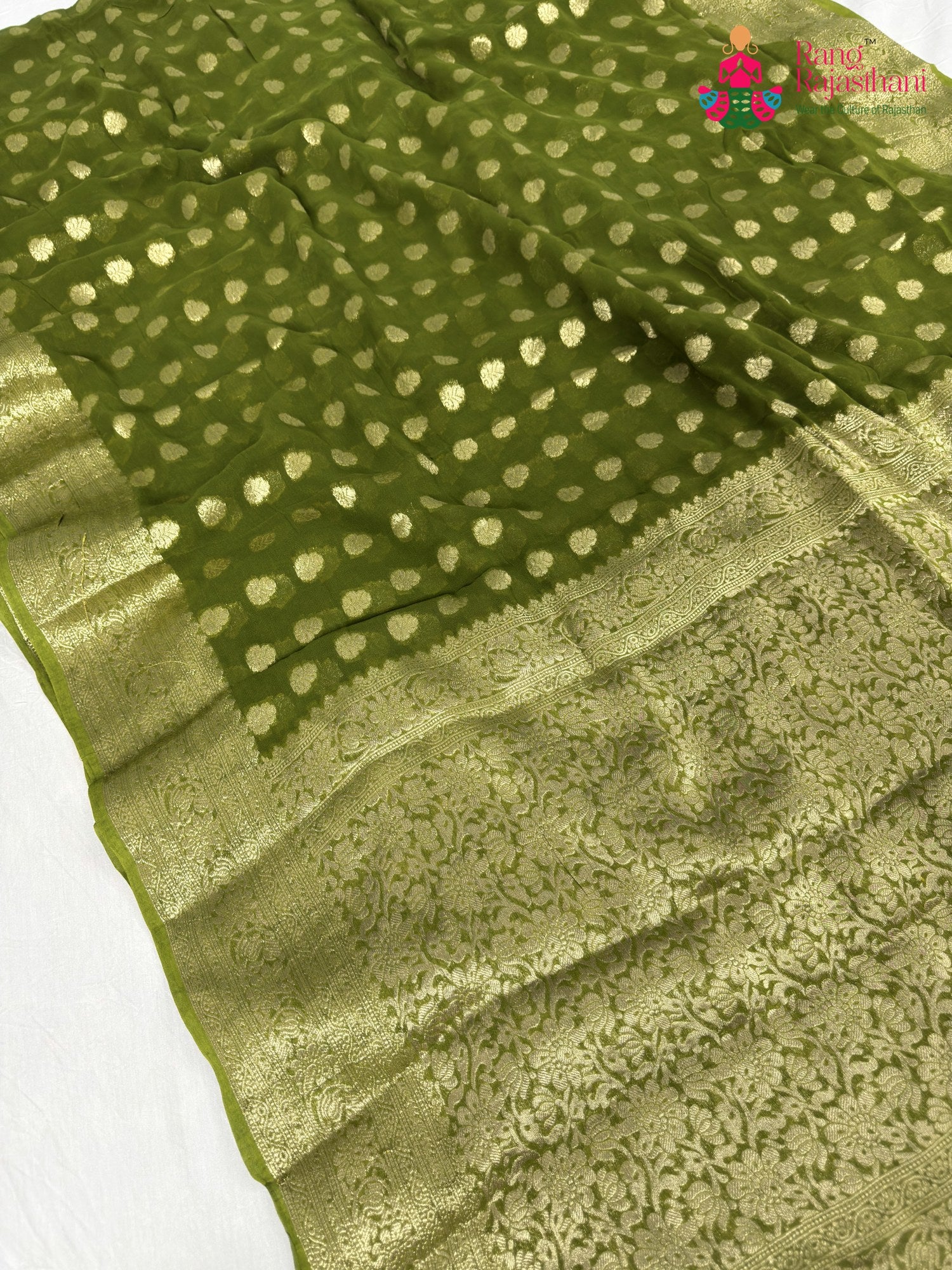 close up detailing of green soft georgette banarasi zari weave saree