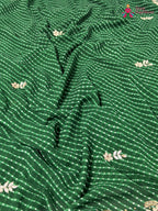 pallu detailing of green soft georgette gota patti saree