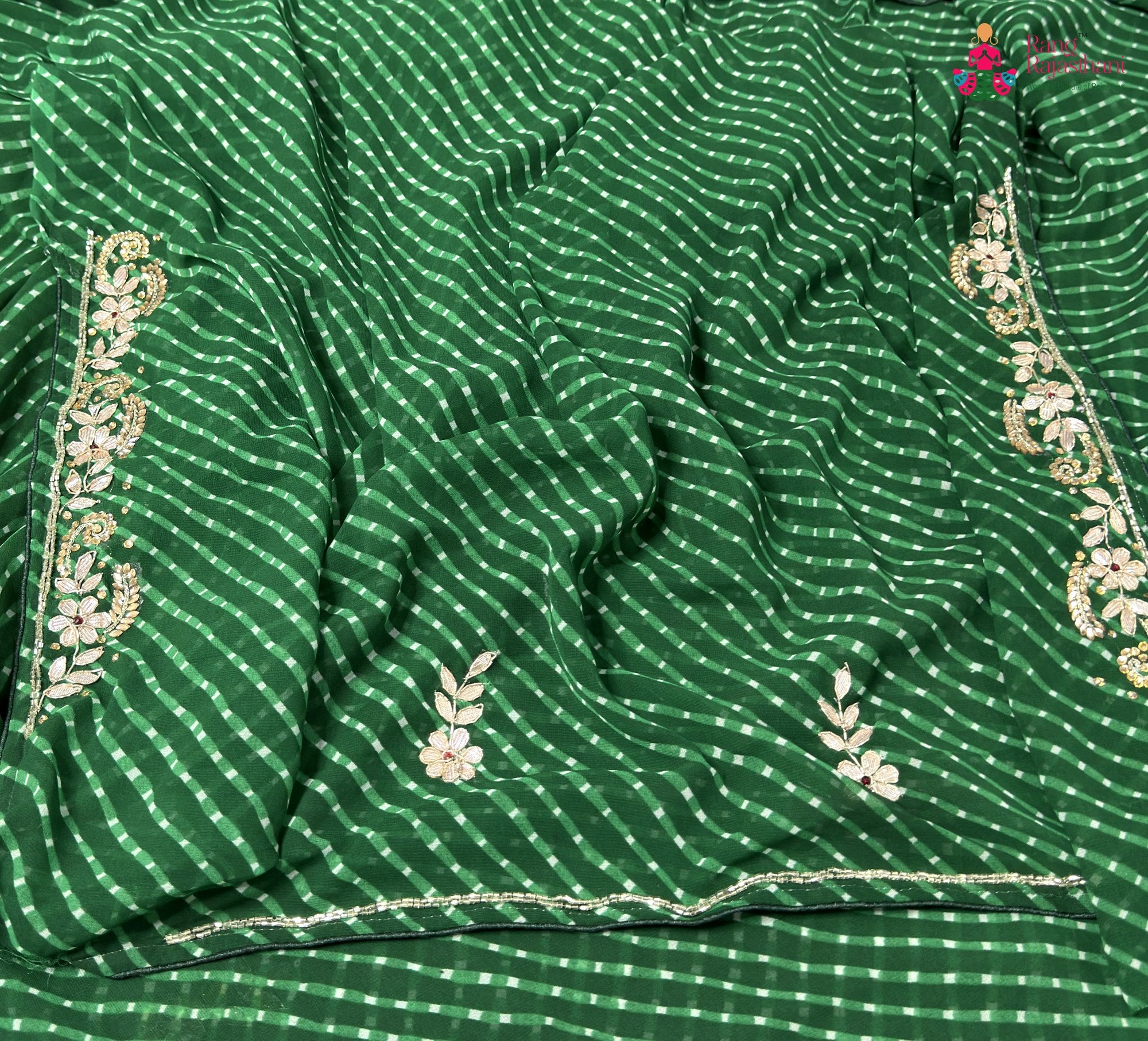 border detailing of green soft georgette gota patti saree
