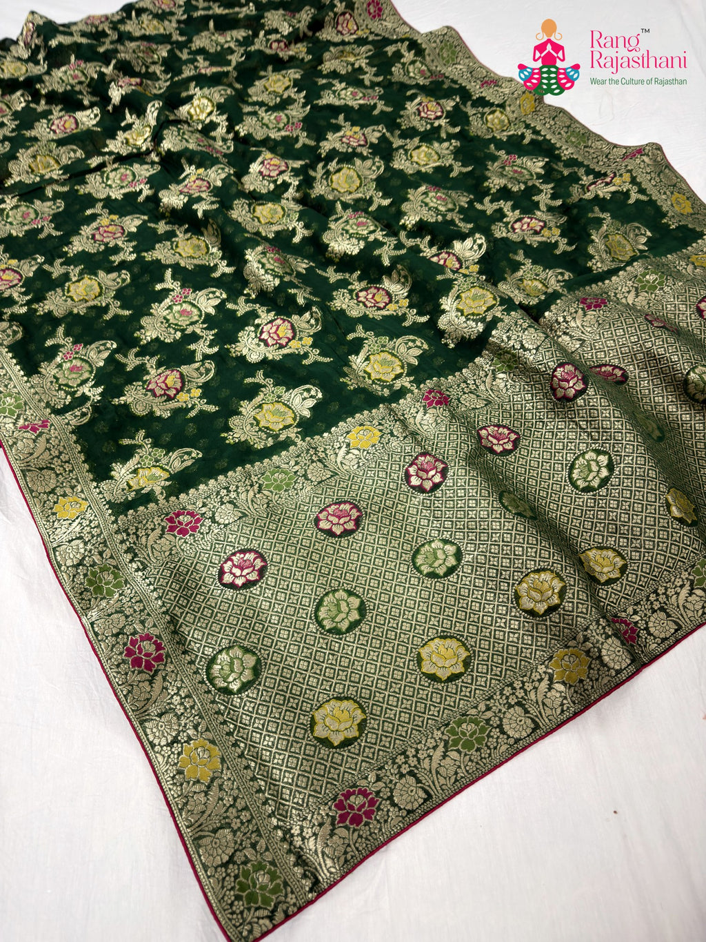 pallu detailing of green soft georgette meenakari zari saree