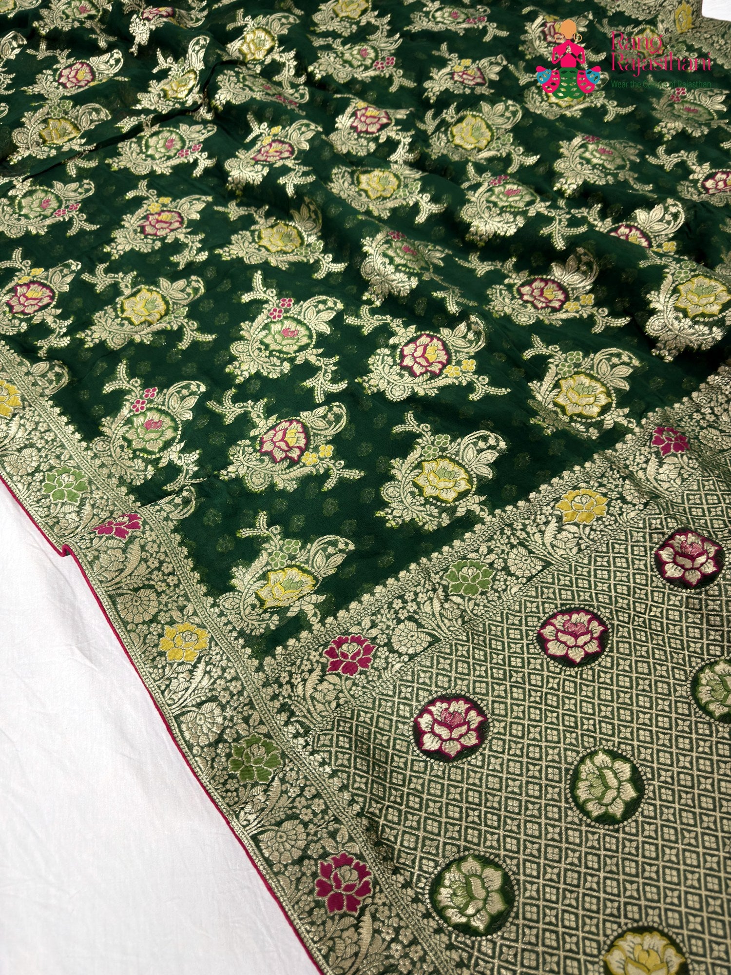 close up detailing of green soft georgette meenakari zari saree