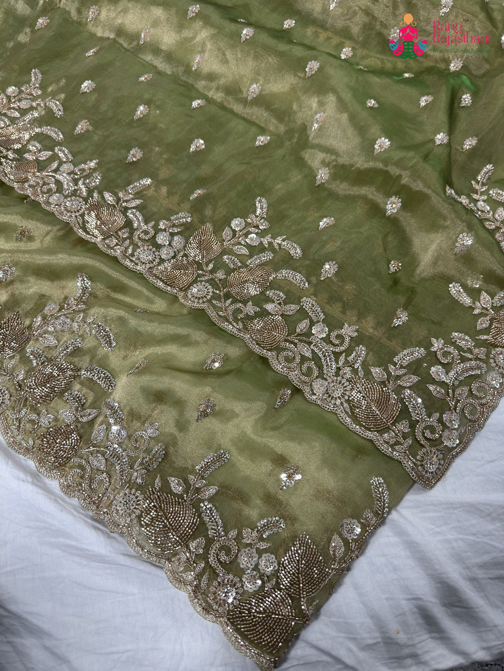 border detailing of green synthetic hand embellishment saree