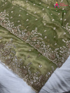 border detailing of green synthetic hand embellishment saree