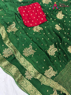 pallu detailing of handcrafted green chinnon saree