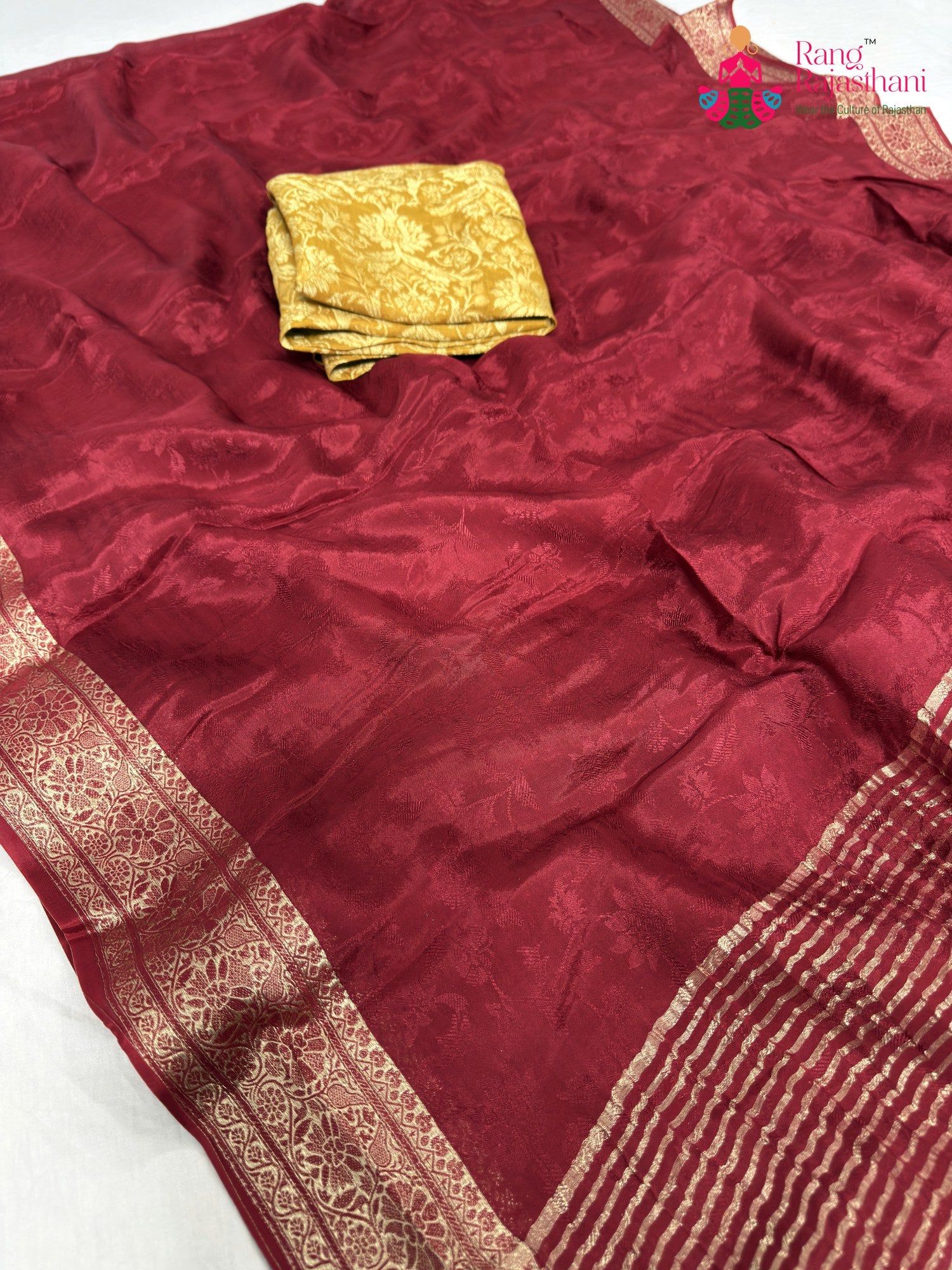 pallu detailing of maroon chinnon jacquard weave saree