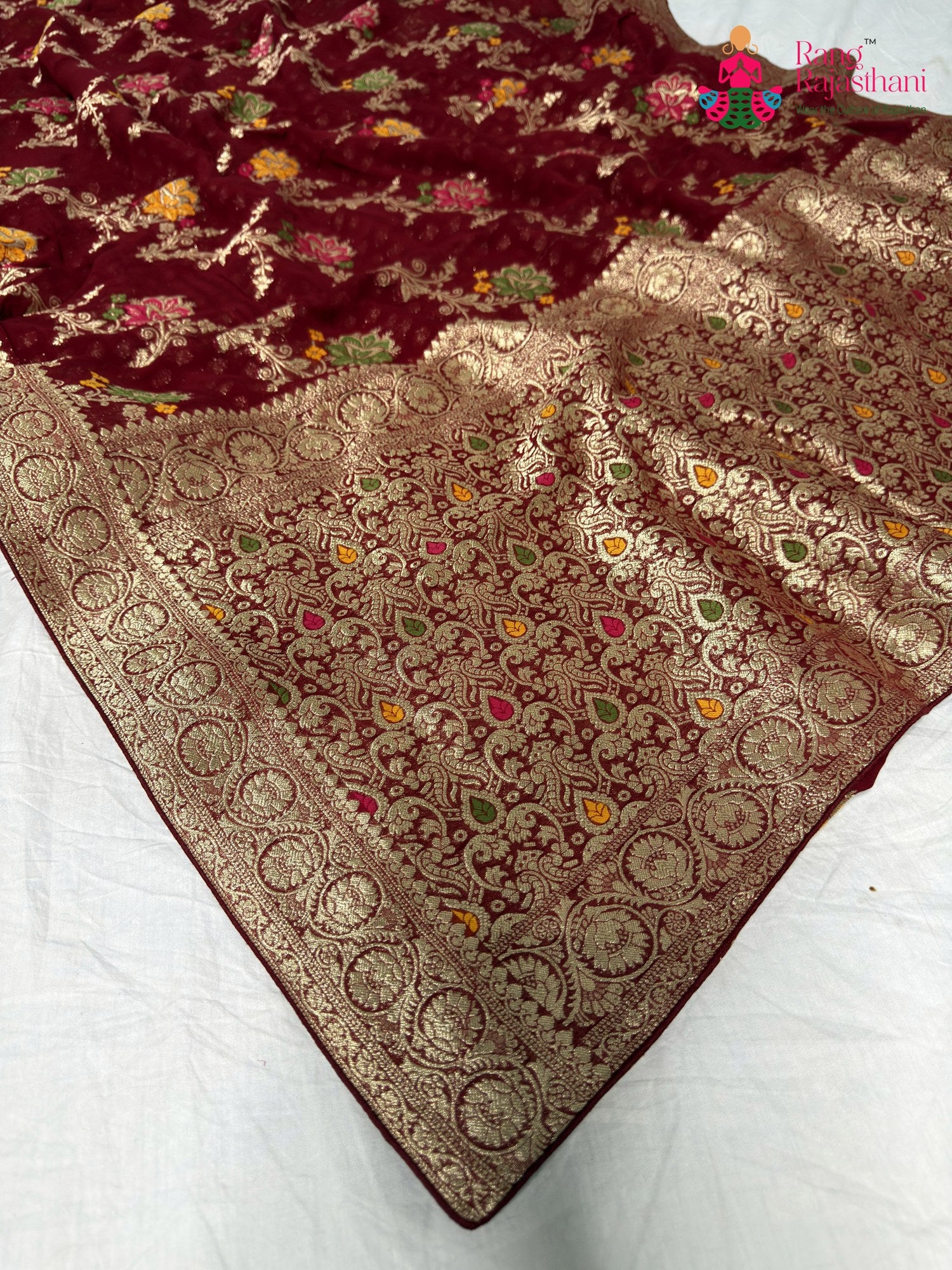 pallu detailing of maharon soft georgette meenakari zari saree