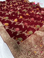 close up detailing of maroon soft georgette meenakari zari saree