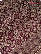 border detail of maroon pure modal silk ajarakh print saree