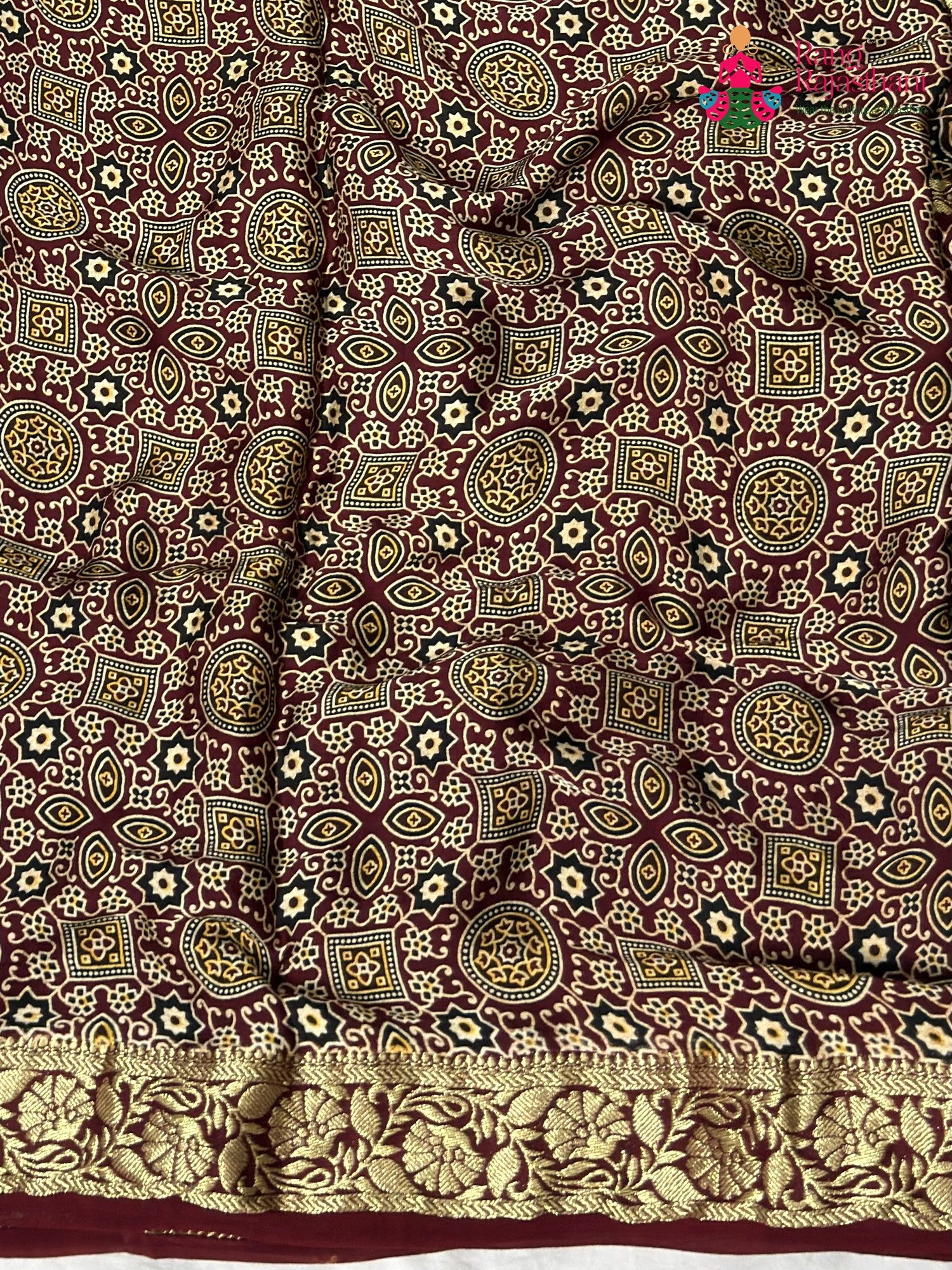 close up view of maroon modal banarasi zari weave gharchola saree