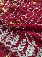 close up detailing of maroon pure gajji silk gota patti saree 