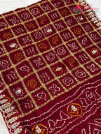 pallu detailing of maroon pure gaji silk gota patti saree