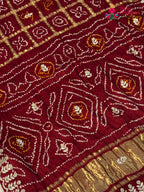border detail of maroon pure gaji silk gota patti saree
