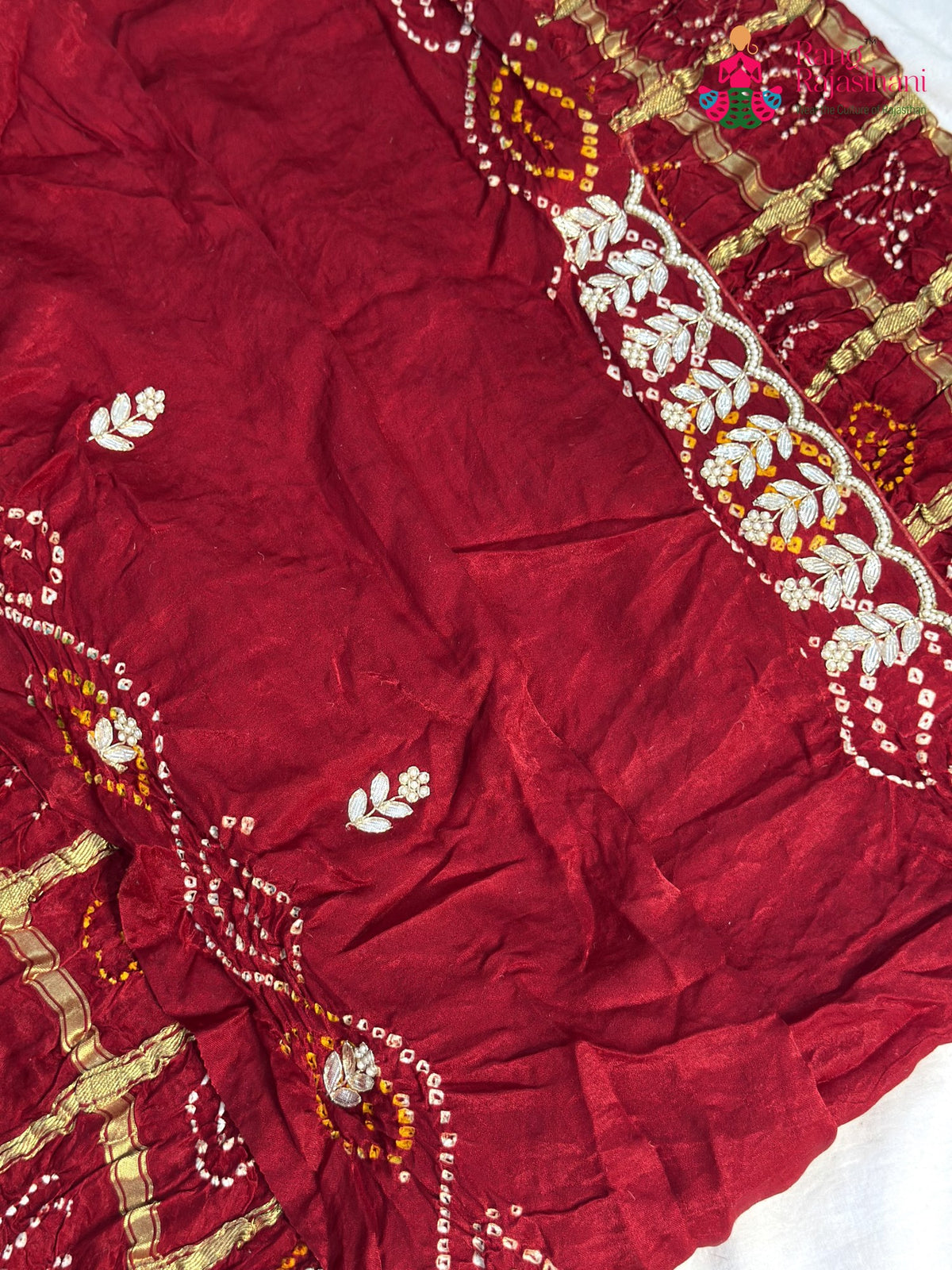 fabric texture of maroon pure gaji silk gota patti saree