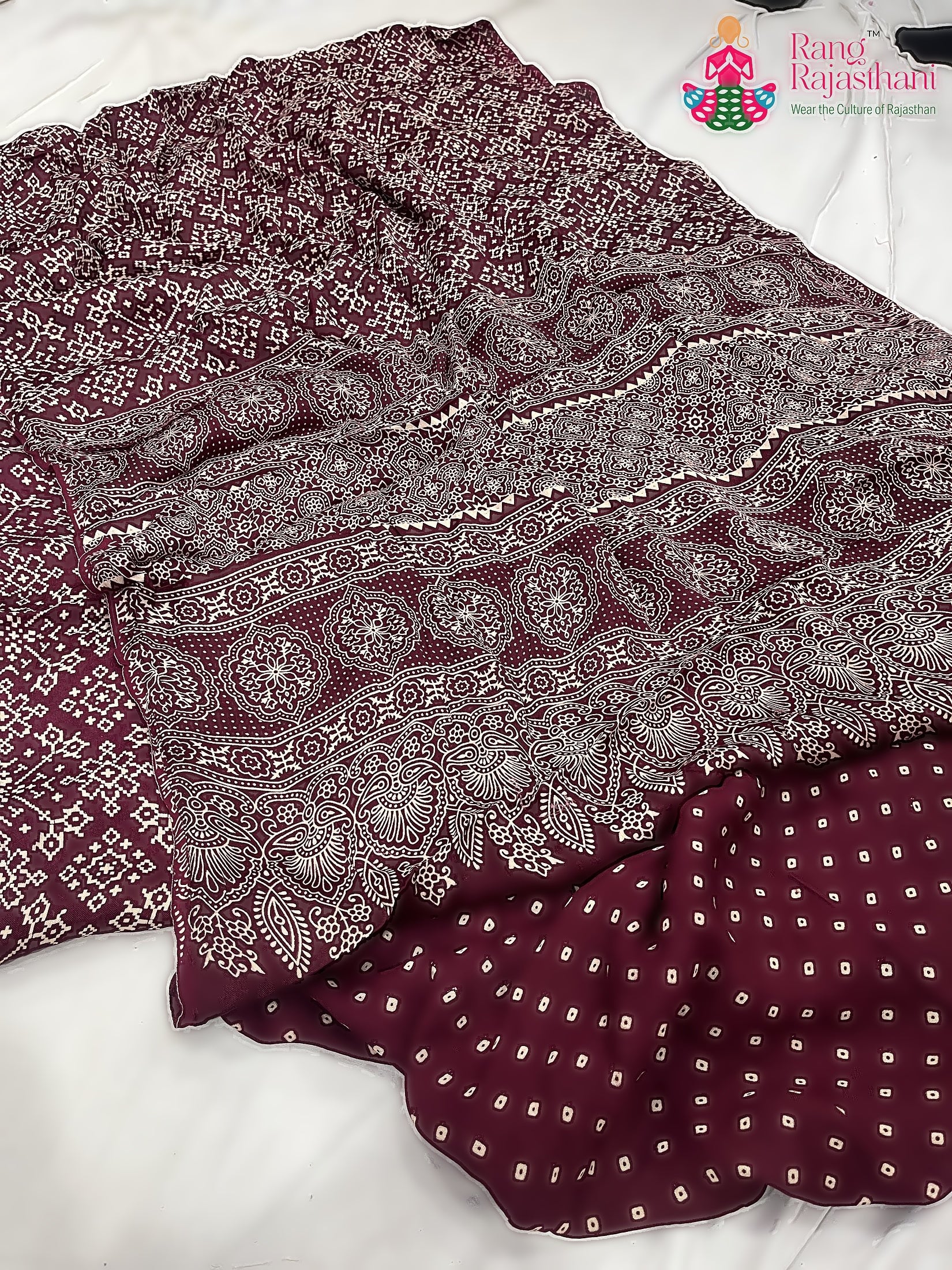 fabric texture of maroon pure modal silk ajrakh print saree 