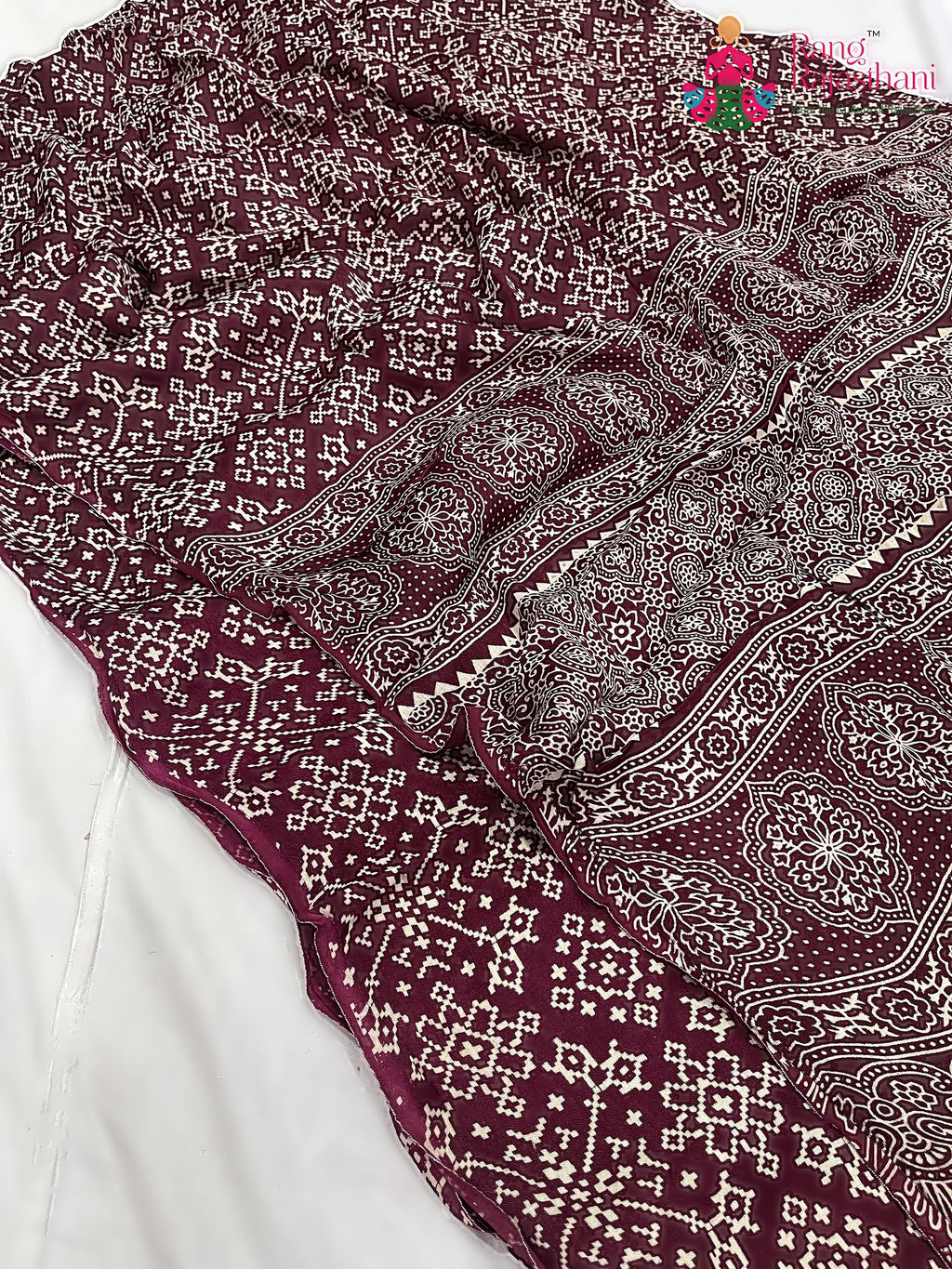 close up detailing of maroon pure modal silk ajrakh print saree 