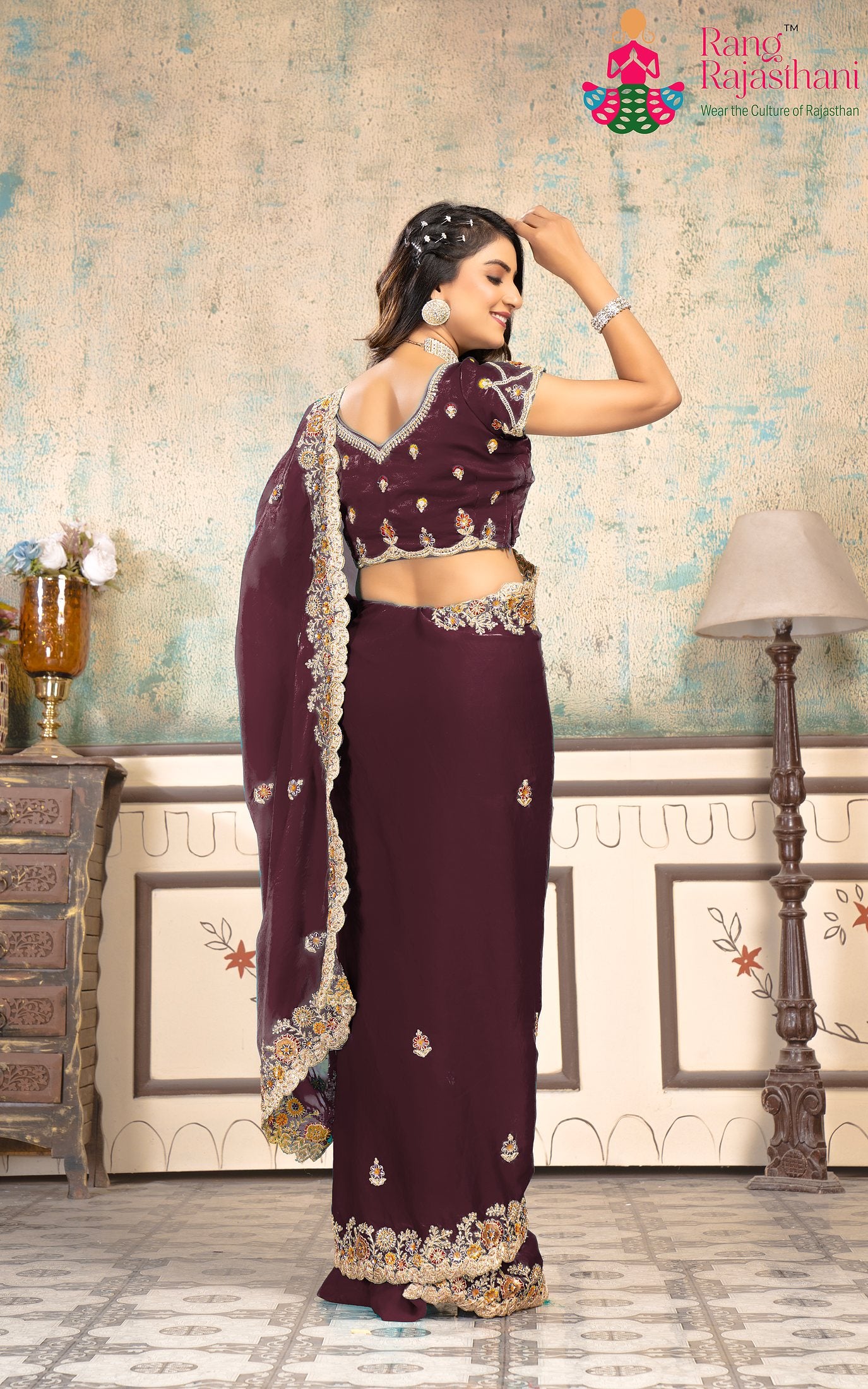 pallu detailing of minimal wine chiffon saree 