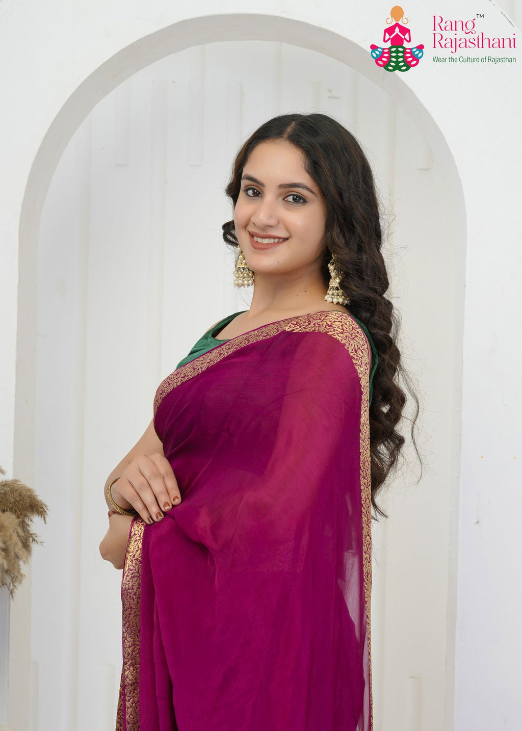 wine pure saree with zari work for traditional function close-up view