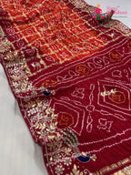 pallu detailing of orange gajji silk hand embellishment saree