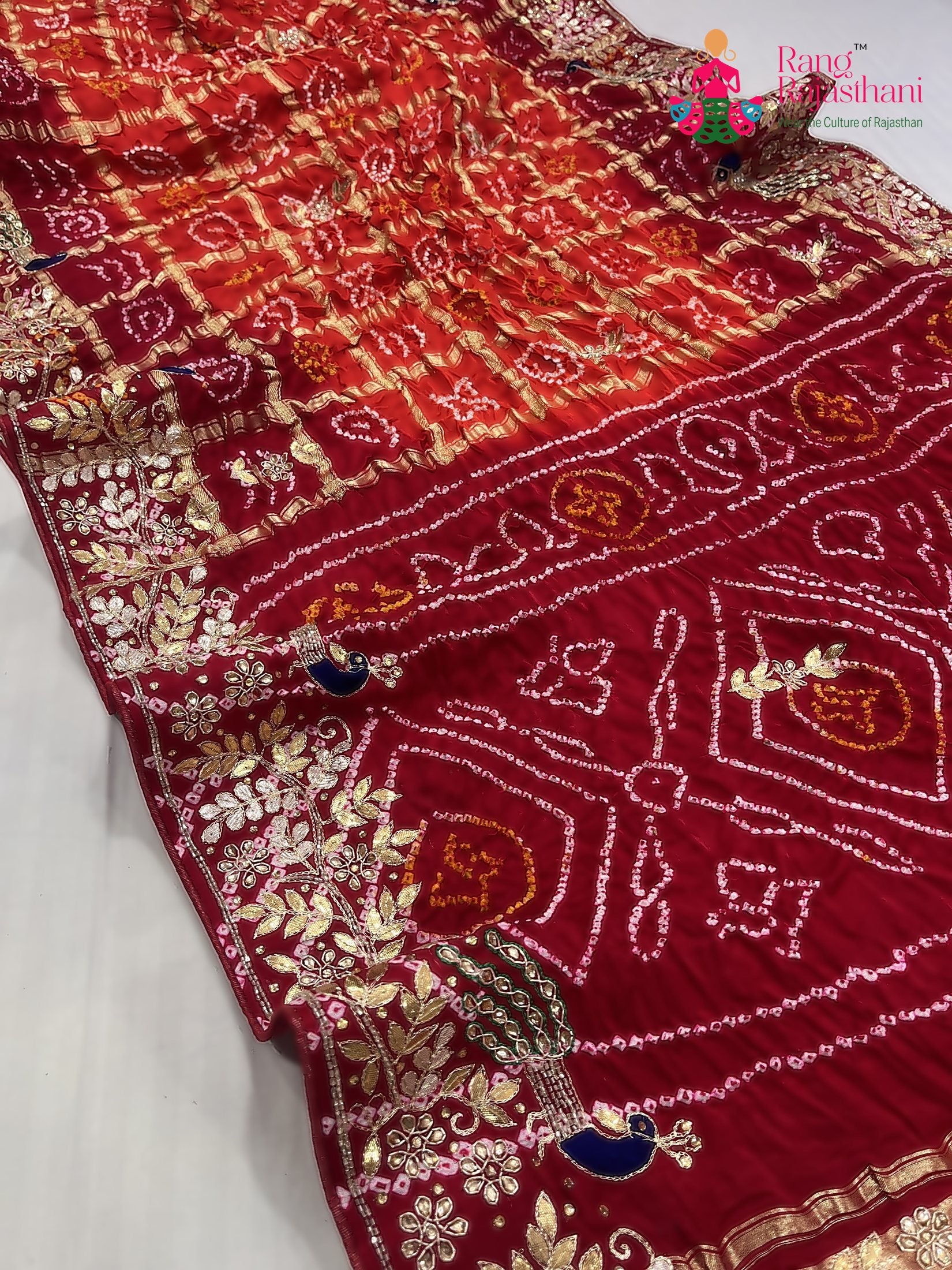 pallu detailing of orange gajji silk hand embellishment saree
