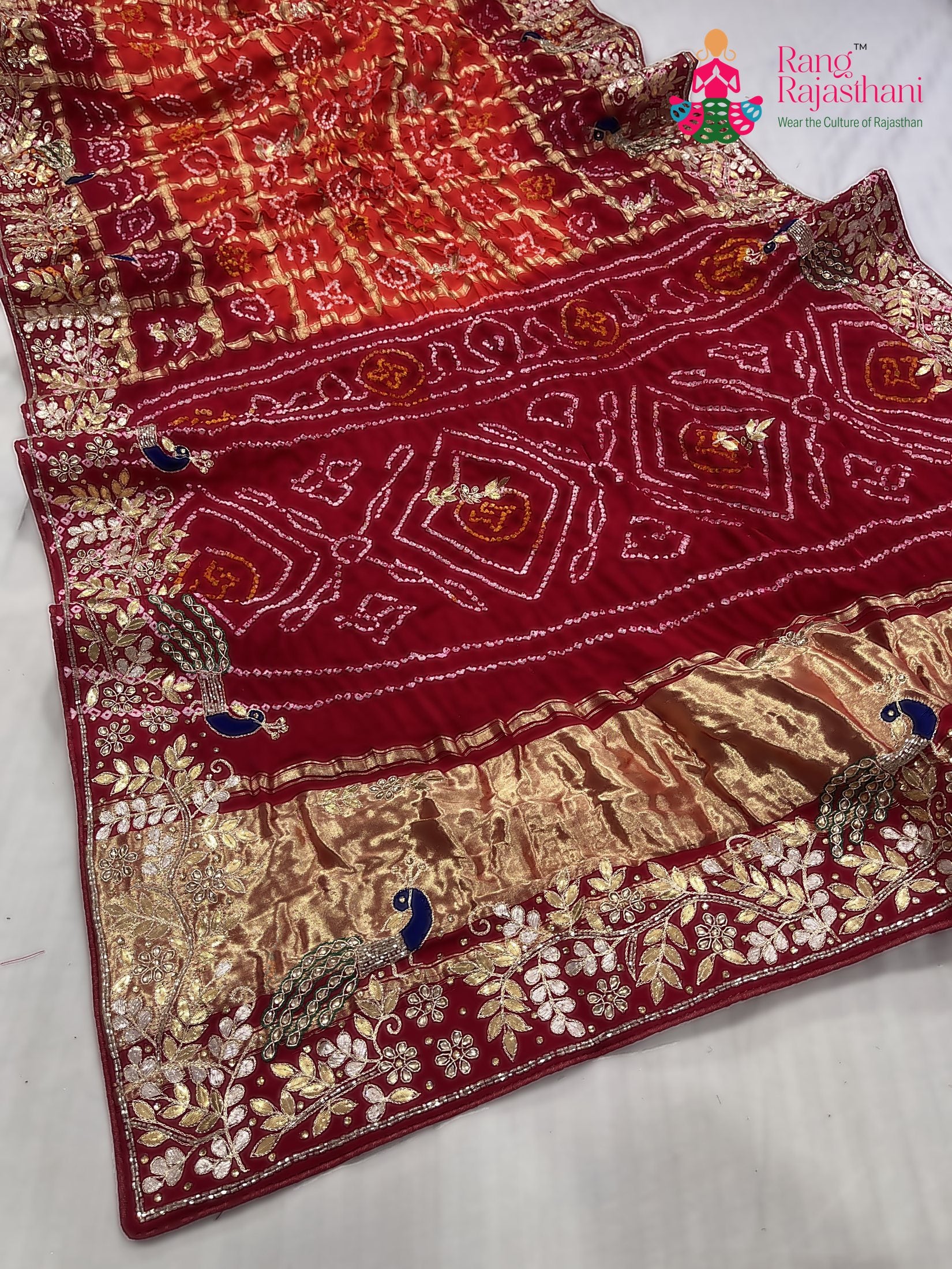 close up detailing of orange gajji silk hand embellishment saree