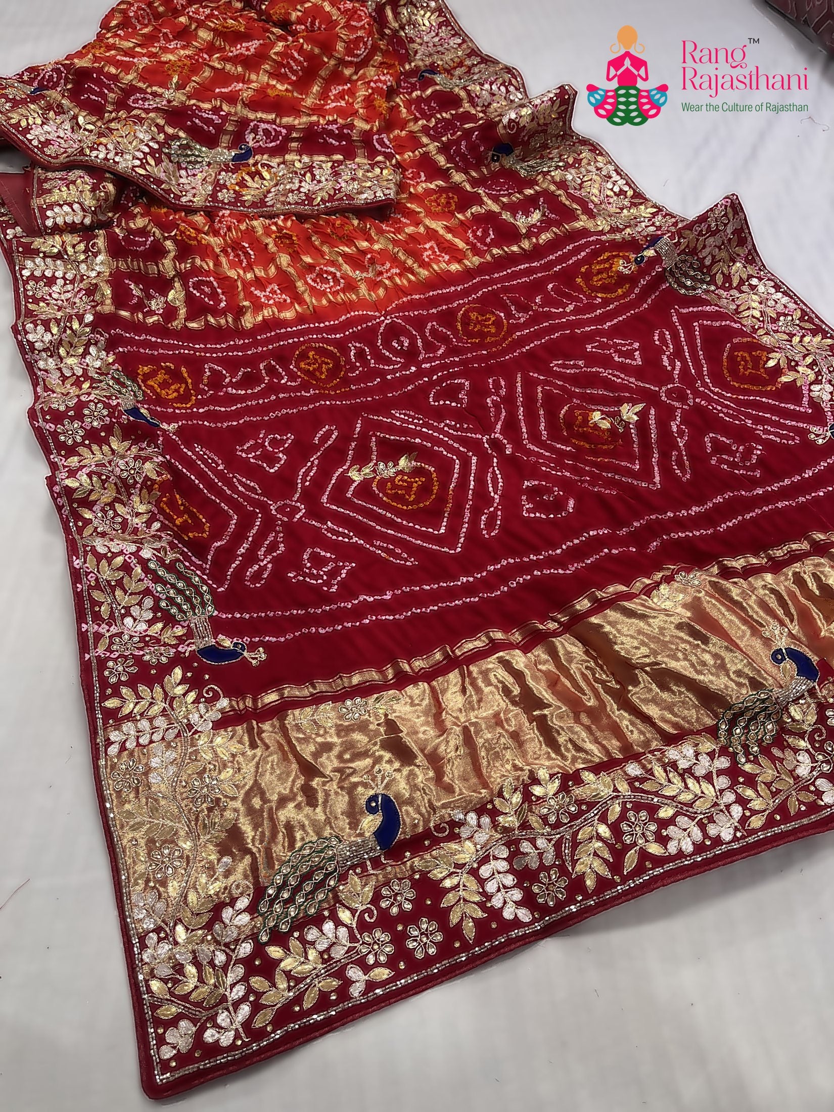 border detailing of orange gajji silk hand embellishment saree