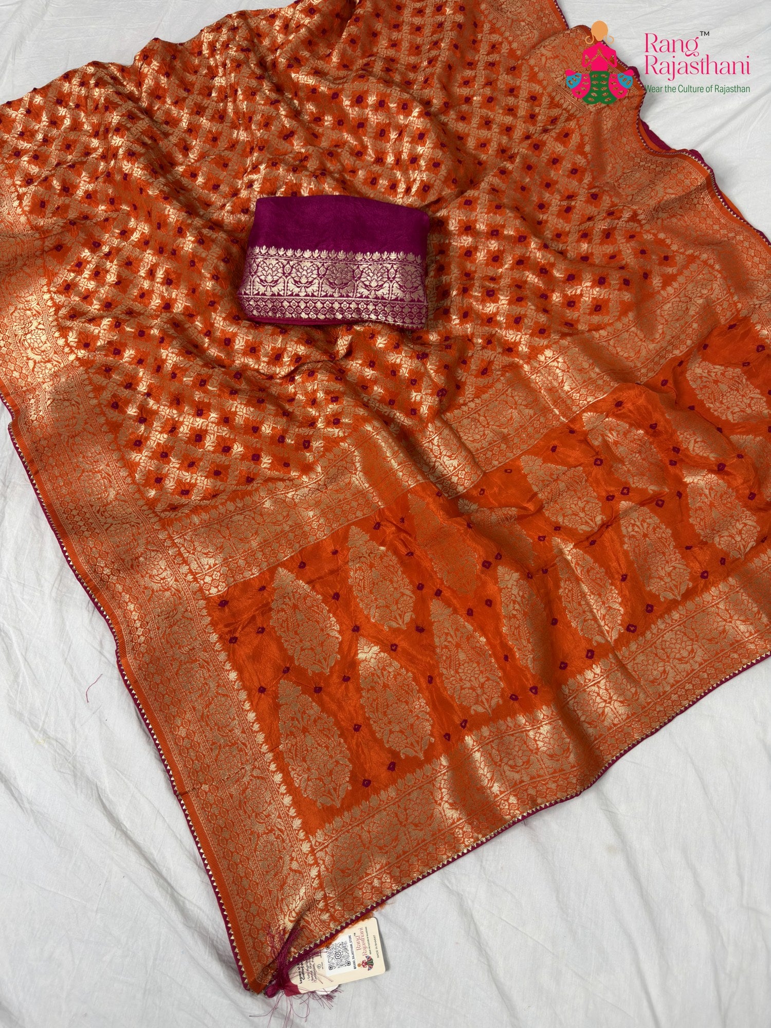 border detailing of orange pure dola silk bandhej banarasi zari saree