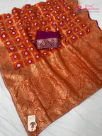 border detailing of orange pure dola silk bandhej banarasi zari saree