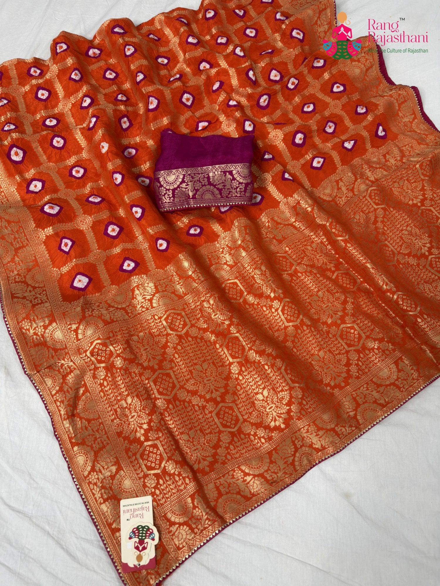 border detailing of orange pure dola silk bandhej banarasi zari saree