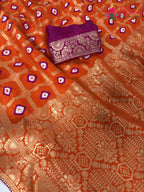 fabric texture of orange pure dola silk bandhej banarasi zari saree