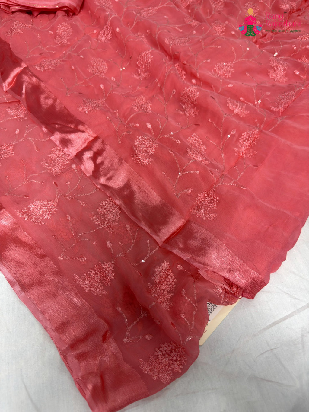 border detailing of peach chiffon resham embroidery saree
