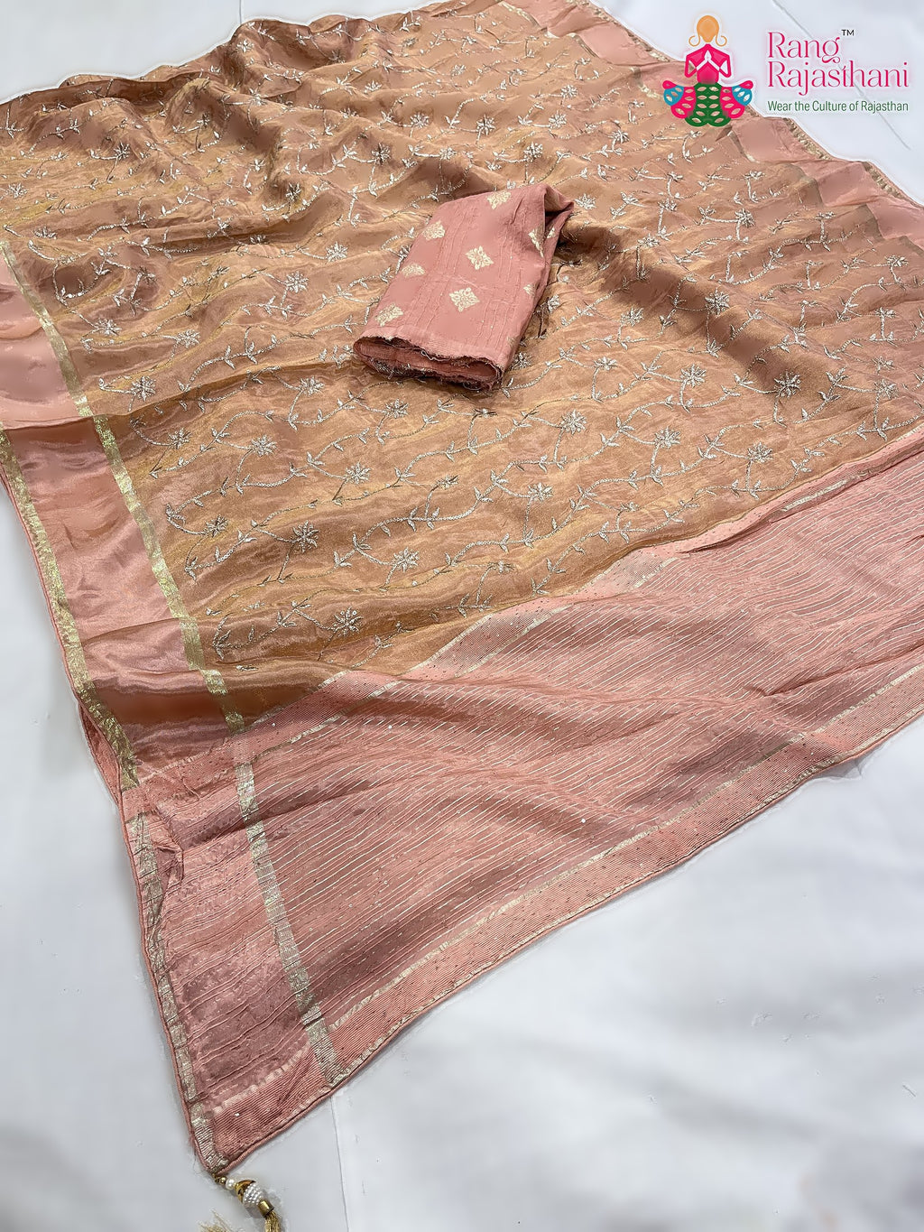 pallu detailing of peach pure tissue silk zari embroidery saree 