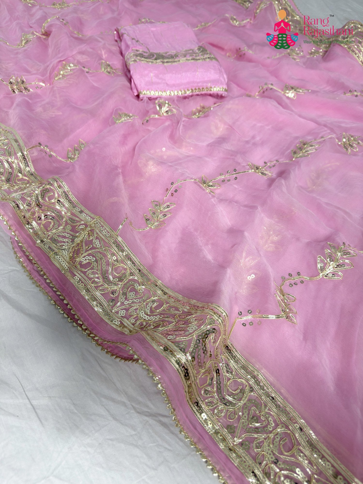 close up detailing of pink chiffon gota patti saree