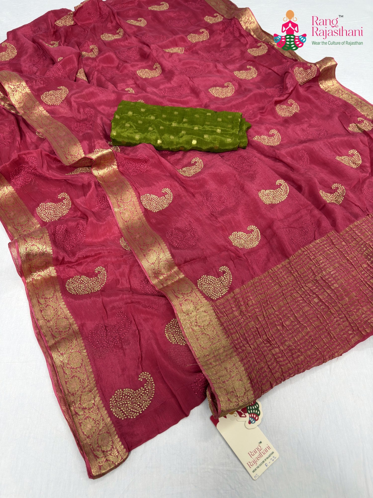 border detailing of pink chinnon zari embroidery saree