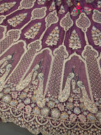 border detail of pink net zari embroidery saree