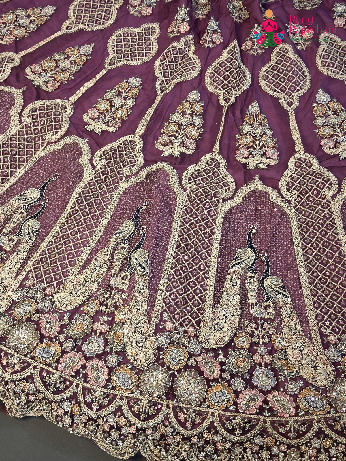 border detail of pink net zari embroidery saree
