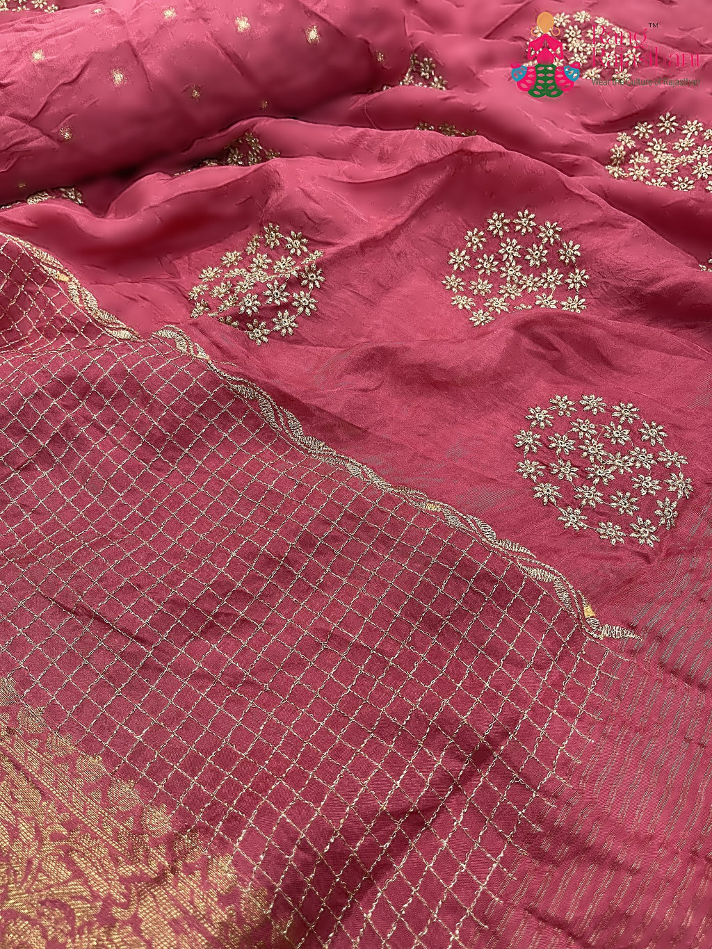 close up detailing of pink pure silk zari embroidery saree 