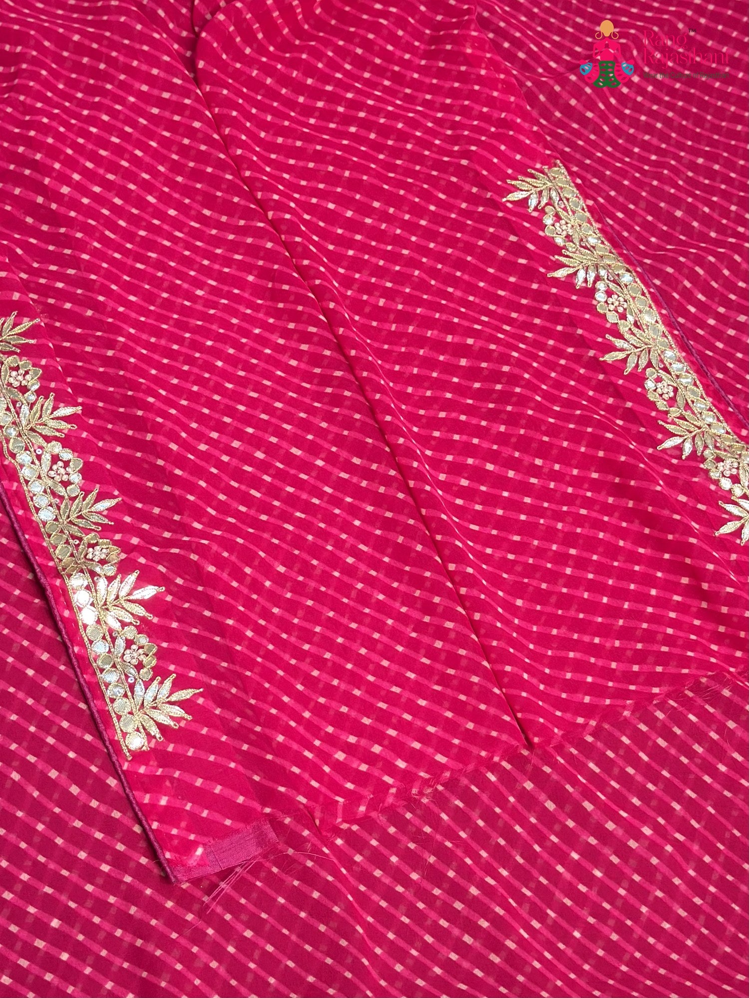 close up view of pink synthetic gota patti leheriya saree