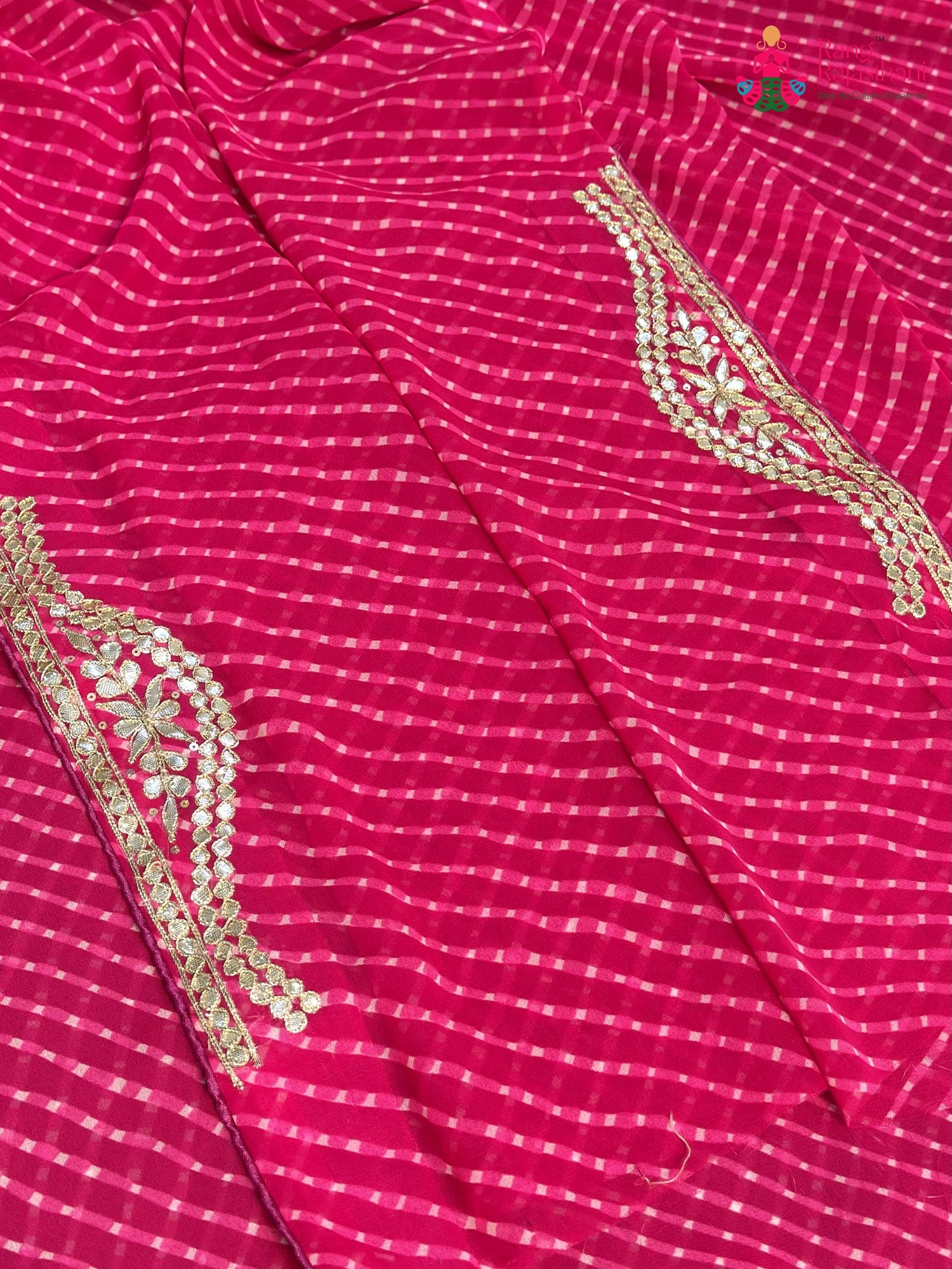 close up view of pink synthetic gota patti leheriya saree