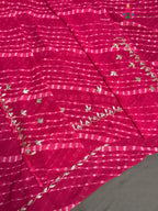 close up view of pink synthetic gota patti leheriya saree