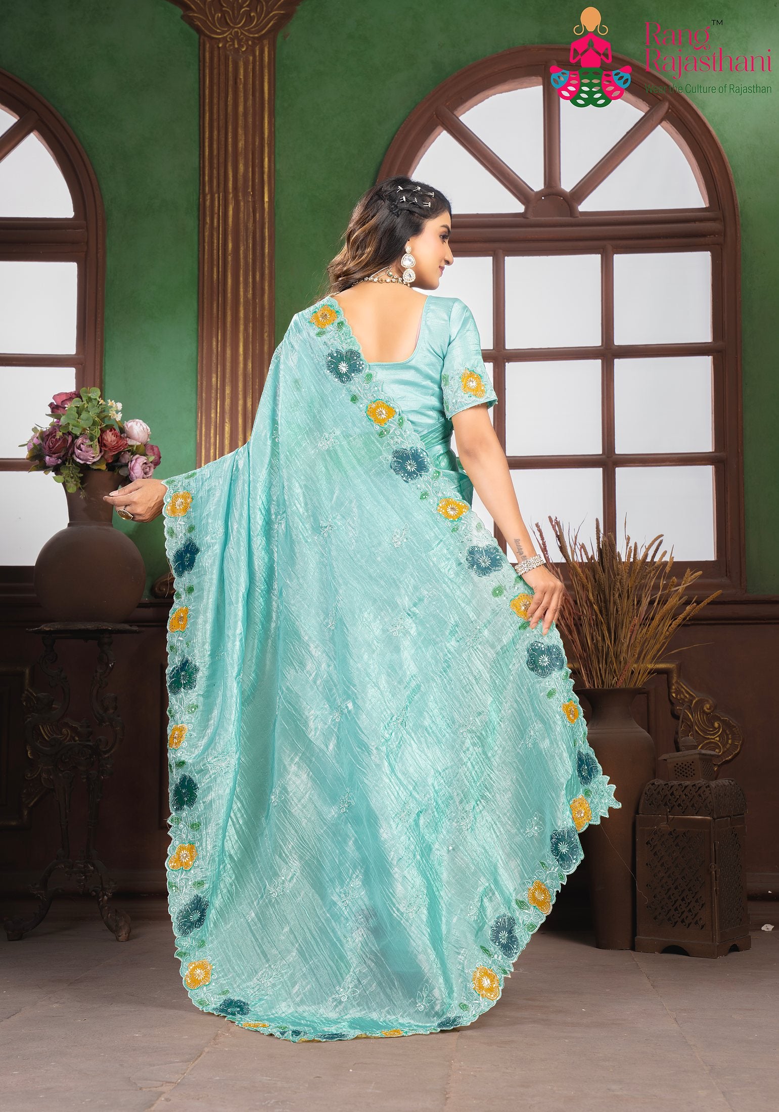 close up detailing of premium aqua fabric saree 