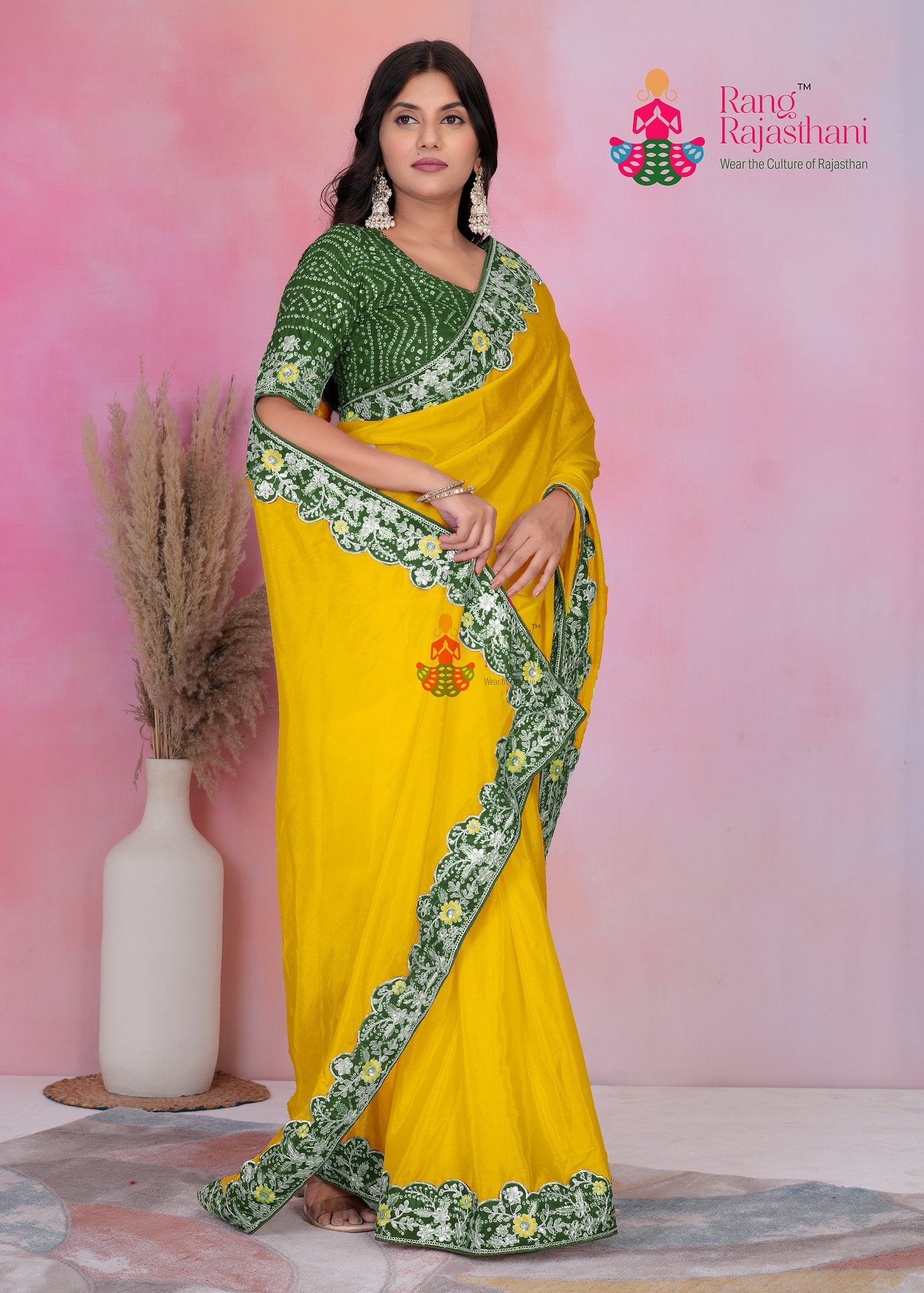 close up detailing of premium yellowr fabric saree 