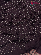 fabric texture of purple pure modal silk ajarakh print saree