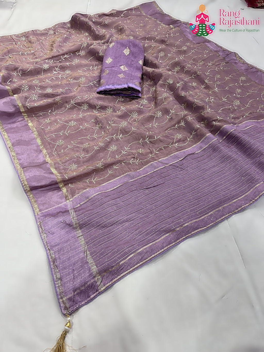pallu detailing of purple pure tissue silk zari embroidery saree 