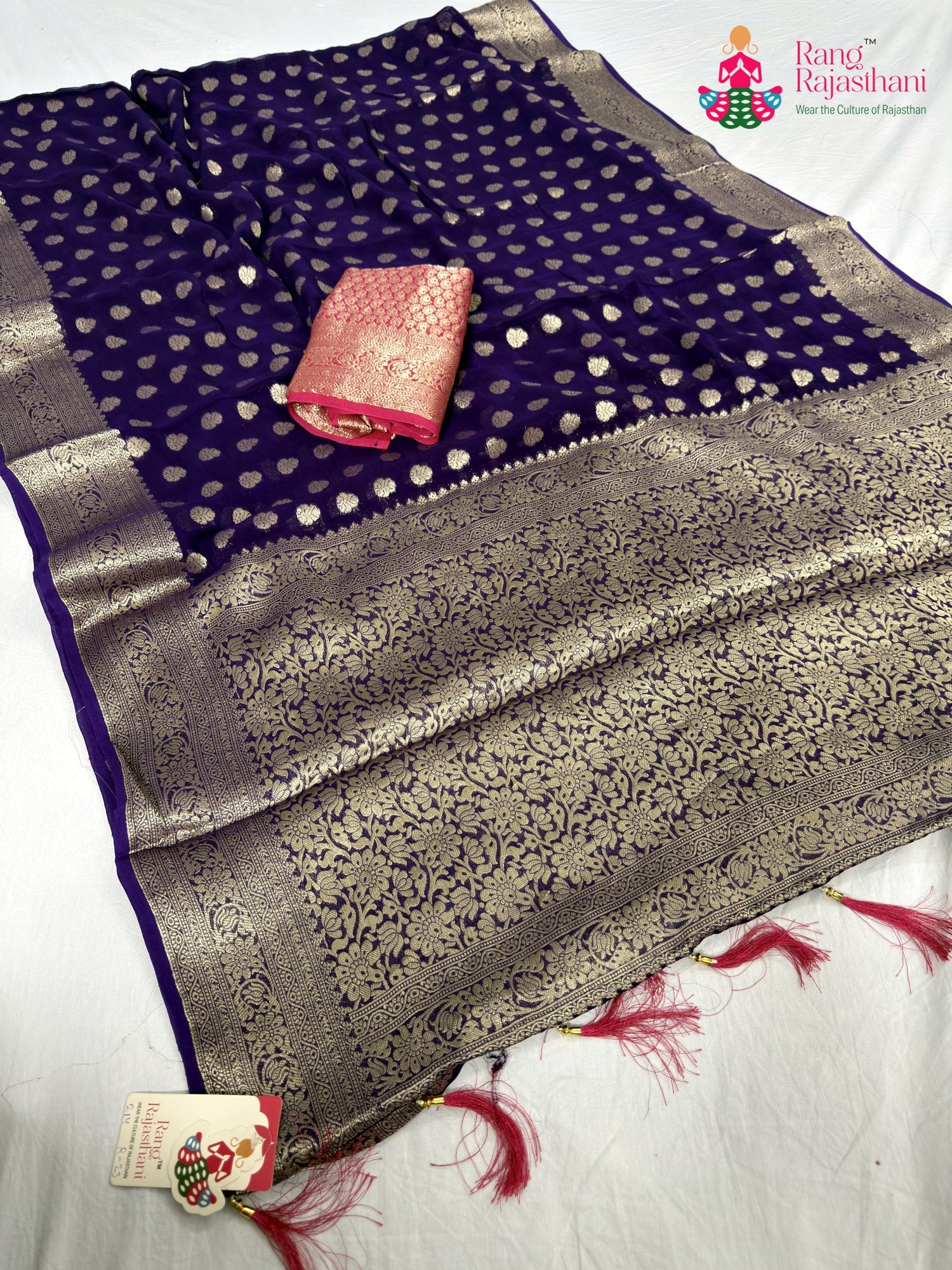 pallu detailing of purple soft georgette banarasi zari weave saree