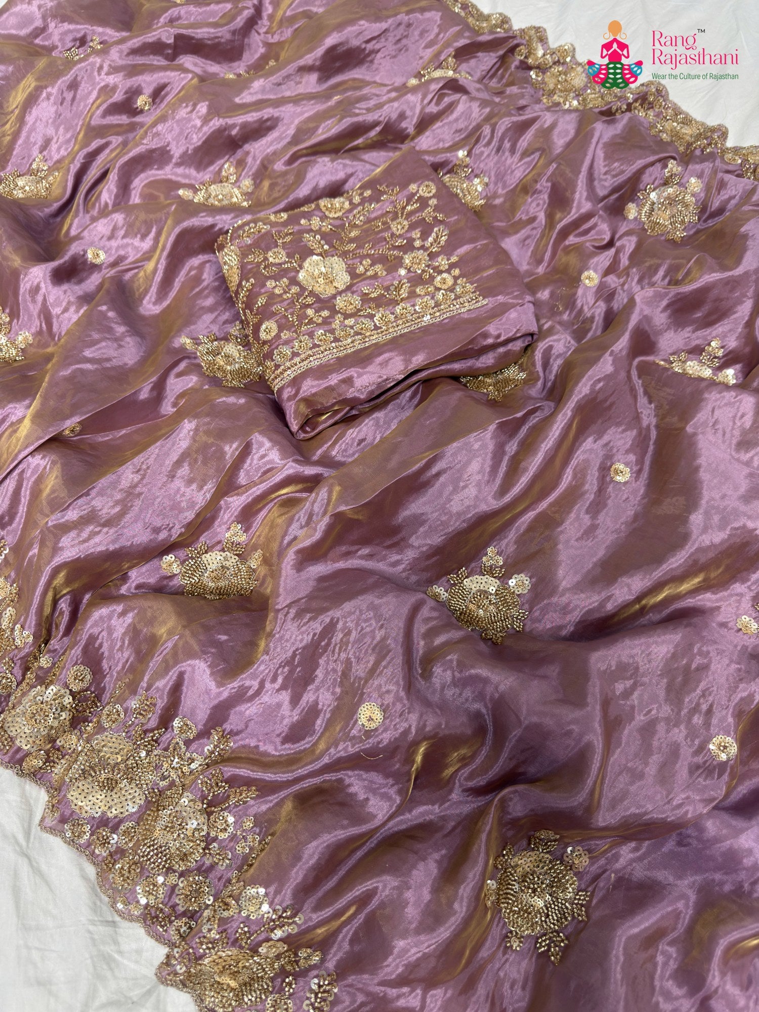 close up detailing of purple synthetic hand embellishment saree